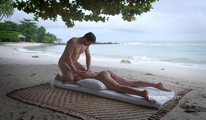 Petite Lilit A enjoys erotic massage on the beach