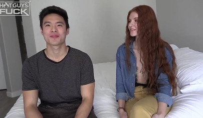 Long haired redhead with small tits takes it from behind