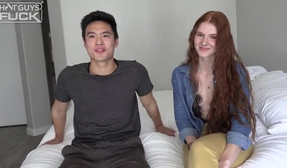 Long haired redhead with small tits takes it from behind