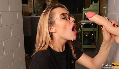 Gorgeous blonde bombshell showing her blowjob skills on dildo