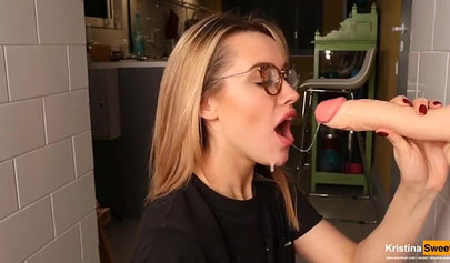 Gorgeous blonde bombshell showing her blowjob skills on dildo