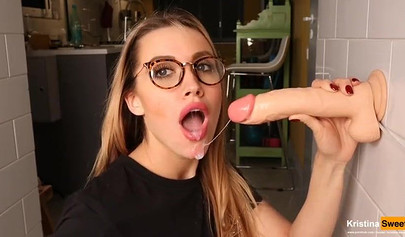 Gorgeous blonde bombshell showing her blowjob skills on dildo