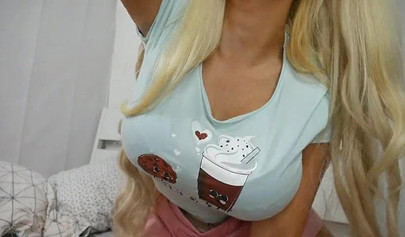 Blonde with huge fake tits and ass showing her skills on a dildo