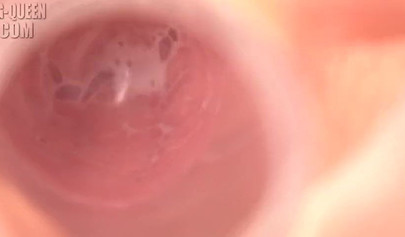 Petite Japanese girl plays with her pussy and toys it with a glass dildo