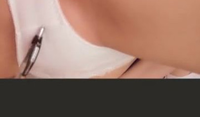 Amateur Asian girl takes off pantyhose and rubs her shaved pussy