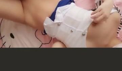 Amateur Asian girl takes off pantyhose and rubs her shaved pussy