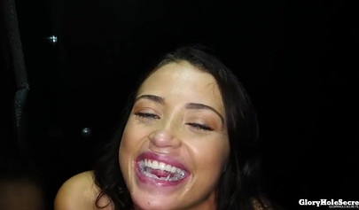 Beautiful Avi Love sucking several stiff cock in gloryhole room