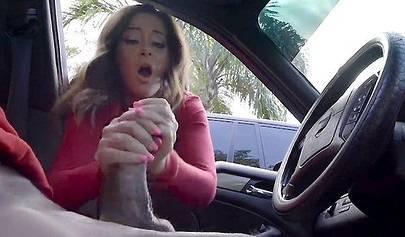 Horny brunette chick give a handjob to a random dude in a car
