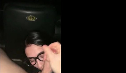 Lusty amateur teenie with sex glasses gives a blowjob at the cinema