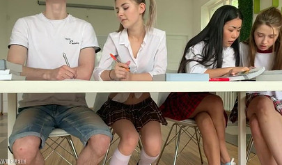 Adorable schoolgirl teases classmate into fucking her over a desk