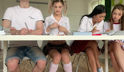 Adorable schoolgirl teases classmate into fucking her over a desk