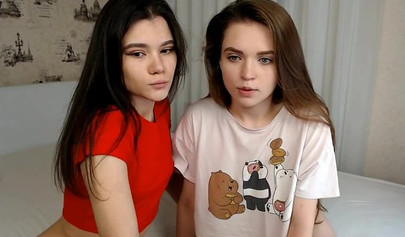 Teen lesbians make out and suck each other's titties on a webcam