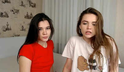 Teen lesbians make out and suck each other's titties on a webcam