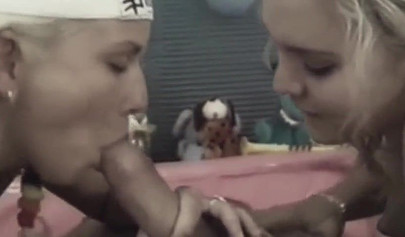 Two adorable teens share a cock and service it with their bodies