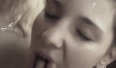 Two adorable teens share a cock and service it with their bodies