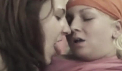 Two adorable teens share a cock and service it with their bodies