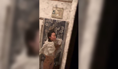 Voluptuous Asian teen wipes her wet naked body after the shower