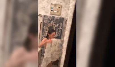 Voluptuous Asian teen wipes her wet naked body after the shower