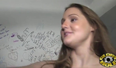 Delectable white teen sucks a black dick in a glory hole