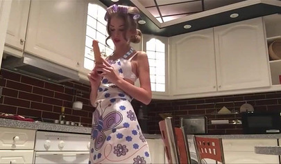 Tantalizing teen undresses in the kitchen and toys her ass hole