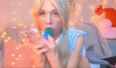 Real life hentai teen sucks on a rainbow dildo before stuffing herself