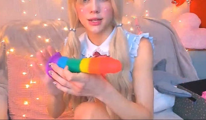 Real life hentai teen sucks on a rainbow dildo before stuffing herself