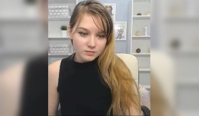 Blonde nubile reveals her body to her fans on a web camera