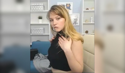 Blonde nubile reveals her body to her fans on a web camera