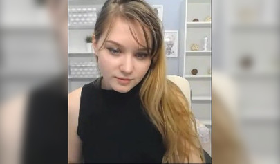 Blonde nubile reveals her body to her fans on a web camera