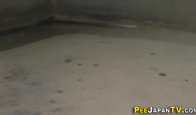 Wicked Asian schoolgirl plays with her pussy over her panties