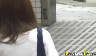 Wicked Asian schoolgirl plays with her pussy over her panties