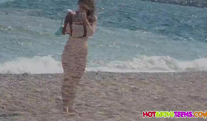 Cute babe with big boobs enjoys a day on a beach