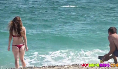 Cute babe with big boobs enjoys a day on a beach