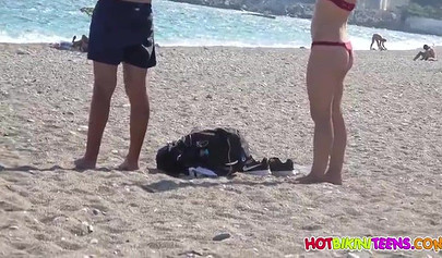 Cute babe with big boobs enjoys a day on a beach