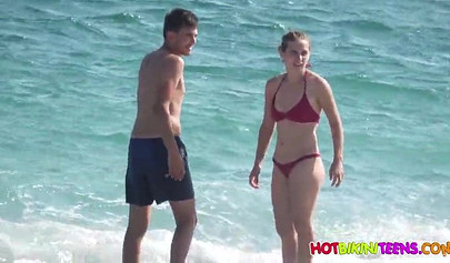 Cute babe with big boobs enjoys a day on a beach