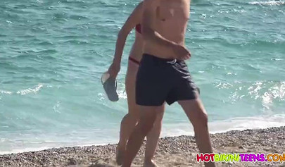 Cute babe with big boobs enjoys a day on a beach