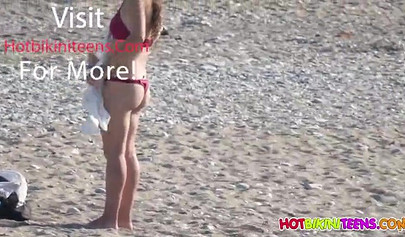 Cute babe with big boobs enjoys a day on a beach