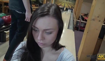 Slut with big boobs sucks her boyfriend's cock in a bowling alley