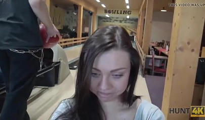 Slut with big boobs sucks her boyfriend's cock in a bowling alley