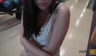 Slut with big boobs sucks her boyfriend's cock in a bowling alley