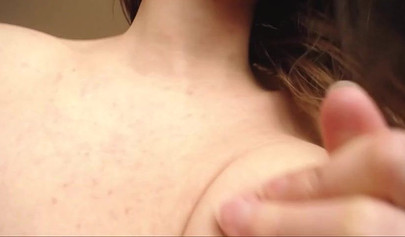 Sensual babe licks her tits while she plays with her pussy