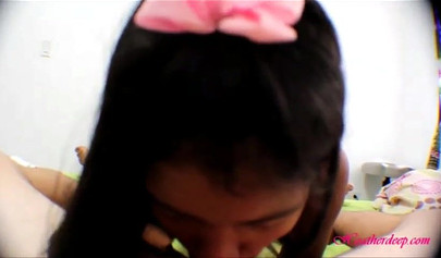 Asian slut with small boobs drinks the cum from a condom