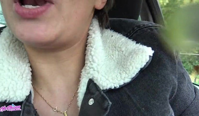 Horny young cutie plays with her pussy in a car and squirts