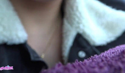 Horny young cutie plays with her pussy in a car and squirts