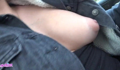 Horny young cutie plays with her pussy in a car and squirts