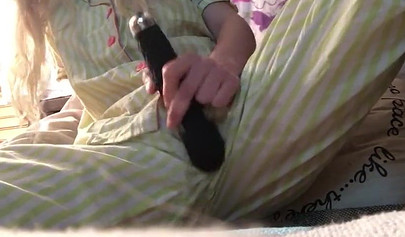 Innocent nubile uses vibrator through pajamas before stripping naked to cum hard
