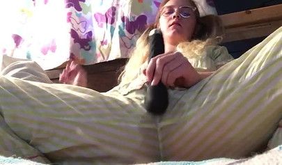 Innocent nubile uses vibrator through pajamas before stripping naked to cum hard