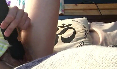 Innocent nubile uses vibrator through pajamas before stripping naked to cum hard