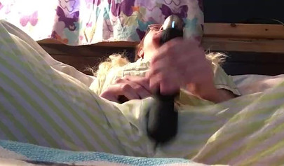 Innocent nubile uses vibrator through pajamas before stripping naked to cum hard