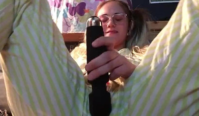 Innocent nubile uses vibrator through pajamas before stripping naked to cum hard